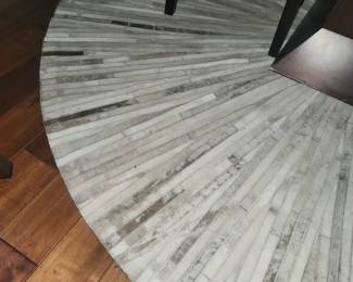 Round pieced hide rug