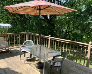 Deck table with umbrella and stand.