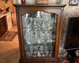 Side load curio cabinet with cut glass.