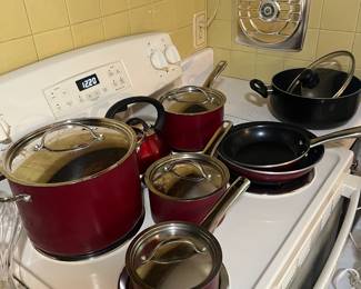 Full set of pots and pans with lids.