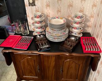 Victorian server would drop leaf sides, serving for eight, and a variety of vintage flatware.