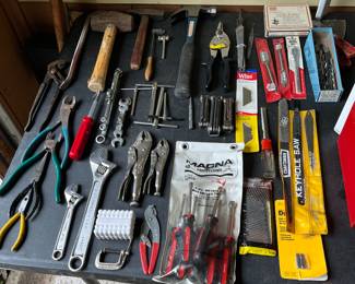 Pliers, vice grips, crescent wrenches, screwdrivers, Allen keys, open/closed end wrench sets, hammers, tin snips, drill bits and saw blades.