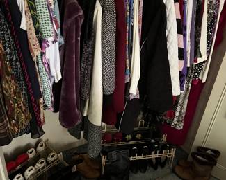 Large assortment of gently used women’s clothes and shoes.