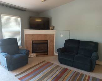 Recliner, rug and reclining loveseat. Smart TV