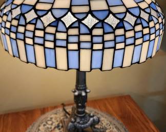 Lamp shade is plastic not glass. Thank you