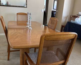 Oak table with leaf & 4 dining room chairs