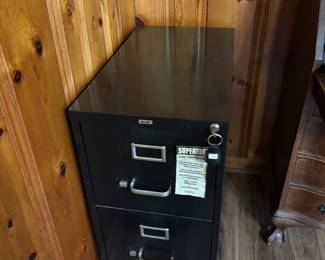 2 drawer file cabinet with lock. Also has hanging lateral file folders in it.