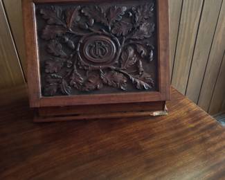This is a beautiful piece. It’s a small secretary, it come an be moved from Place to place. Very ornate carving on the front.