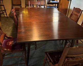 Antique swing arm table with 10 Chairs with 6 having tapestry bottoms and 4 with cane bottoms.