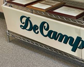 DeCamp Bus Lines Hanging Sign