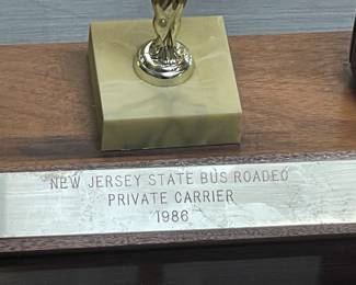Assorted Trophies Awarded To DeCamp Bus Lines