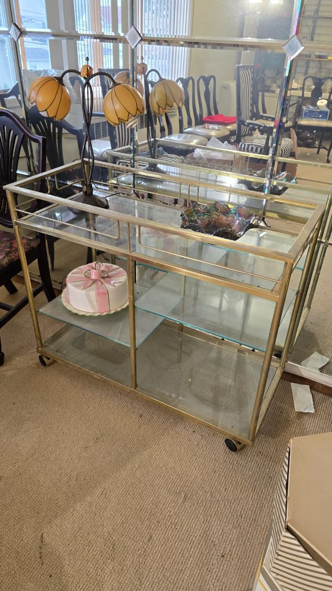 Rare Vintage Mid-Century Glass/Metal Bar Cart (bundled with matching side table preferred) --- Beautiful vintage entertaining piece. What a rare find! Get both pieces (this and the matching side table) together. This bar cart is about 3' wide and has four glass shelves and an elegant design. Don't miss out!