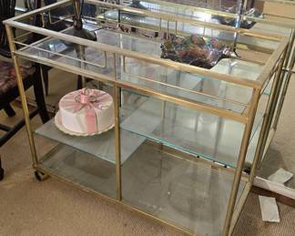 Rare Vintage Mid-Century Glass/Metal Bar Cart (bundled with matching side table preferred) --- Beautiful vintage entertaining piece. What a rare find! Get both pieces (this and the matching side table) together. This bar cart is about 3' wide and has four glass shelves and an elegant design. Don't miss out!