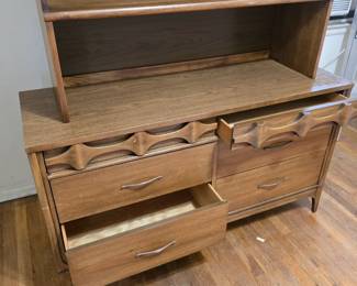 This beautiful hardwood set of matching pieces is a great value. They are made of walnut and elm. The dresser and chest of drawers have semi-hidden drawers with beautiful detailing that make them not appear to be drawers. The pieces come with original, vintage hardware (note: one handle is broken so you may want to repair/replace).
Dimensions:
1) Dresser: 54"w x 30.5 x 17.75D
2) Hutch/Top/Bookshelf: 44 x 46 x 13.5D
3) Chest of Drawers: 36w x 41" x 18D