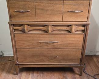 This beautiful hardwood set of matching pieces is a great value. They are made of walnut and elm. The dresser and chest of drawers have semi-hidden drawers with beautiful detailing that make them not appear to be drawers. The pieces come with original, vintage hardware (note: one handle is broken so you may want to repair/replace).
Dimensions:
1) Dresser: 54"w x 30.5 x 17.75D
2) Hutch/Top/Bookshelf: 44 x 46 x 13.5D
3) Chest of Drawers: 36w x 41" x 18D