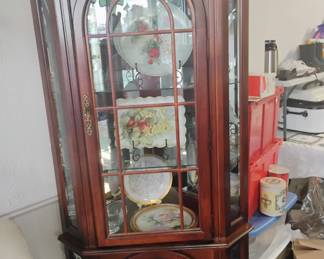 Large mirrored and lighted corner curio cabinet $150