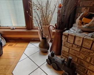cast iron train,copper jugs and dried flowers