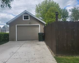 Enter on May Street through this garage door. Do NOT use front or side door.
