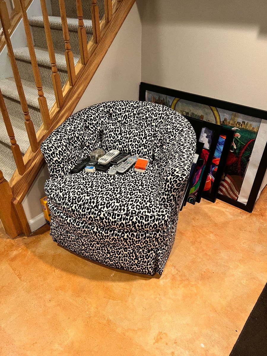 Leopard upholstered swivel/rocking chair. call for pre-sale. Art work by local artist