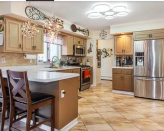 Lovely kitchen with kitchen items, cooking items, and wall art.