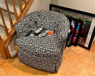 Leopard upholstered swivel/rocking chair. call for pre-sale. Art work by local artist