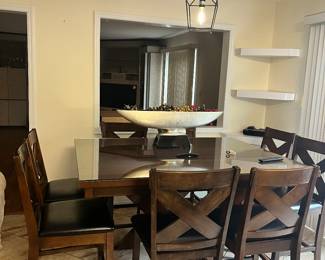 Pub height table with 8 chairs. Available for pre-sale
