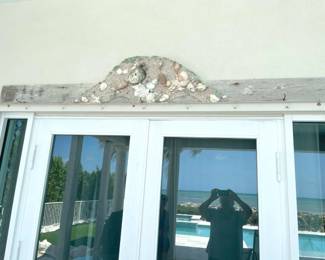 $50 Over-the-door driftwood art. Measures 89”W x 14”H.