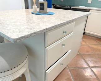 $600 OBO Kitchen island, 63”W x 45.5”D x 36”H including marble top – white with blue vein & “diamond” accent. Island box features six drawers and (1) double cabinet with roll out drawers.