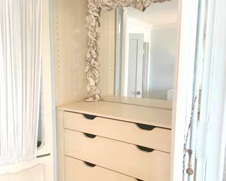 $300 Armoire -- This is a homemade armoire built around two tall cabinets (likely Drexel or similar). It separates in to (4) pieces – a base, topper, and two cabinets one of which has a built in, shell mirror. The outer doors have a very pale blue paint finish in the Shabby Chic style, with fine metal grill inset with gathered curtain on rod interior. Total measurement is 83”W x 21”D x 84”H.