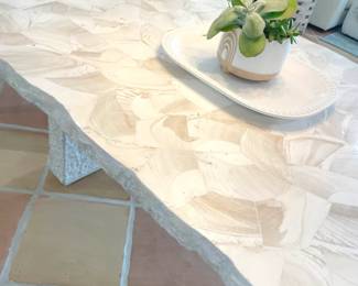 $3,200 Designer Palecek dining table, seats 6. (New, this table likely sold for $10,000+.) This is from the Camilla Collection and features fossilized clam shale top with a natural edge, and a chiseled “stone” base.