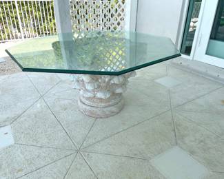 $200 Low cocktail table with thick glass over plaster base. Glass is octagonal and thick. 56”W x 27”H.