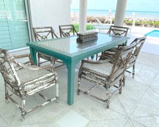 $700 Authentic vintage wood glass-topped dining table & 6 chairs, naturally distressed. Table has faint green finish, glass top over wood lattice and sturdy wood construction. Chairs are bamboo, have cushions, and feature distressed taupe-color paint over white, all peeling artistically. Table measures 79”L x 40”W x 30”H.