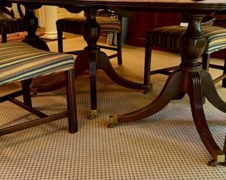 Three pedestal mahogany dining table and ladder back Chippendale chairs
