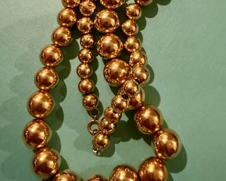 Large 14k graduated ball necklace
$900