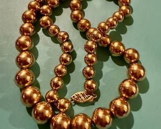 Large graduated gold ball choker in 14k
$900