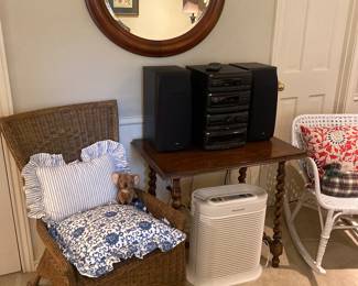 Natural wood rattan chair & blue & white pillows
Honeywell air purifier
White wicker rocking chair
JVC stereo - sounds great!!
Round mirror
Barley twist table