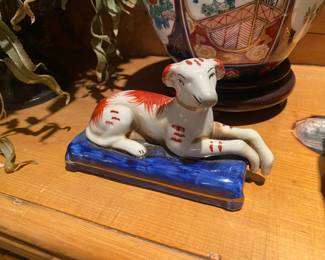 Porcelain dog on pillow