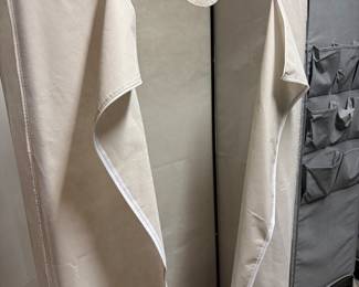 Clothing rack with dust cover