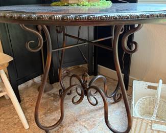 Metal legs on round table. 38 inches across