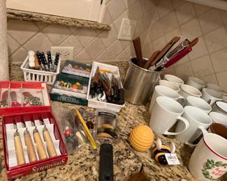 Coffee mugs, cheese spreaders, utensils