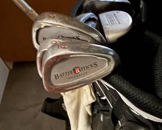 Battle sticks golf clubs and putters