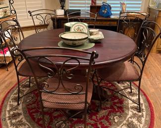 Round table with 6 metal chairs with padded seats