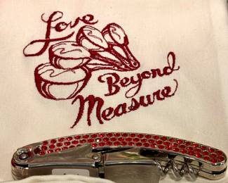 (SOLD; Love Beyond Measure dish towel) (SOLD; red studded wine opener)