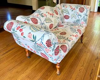 SOLD; custom upholstered designer love seat with camel back, black corner braces, and large botanical design; 73x31x37; view of front