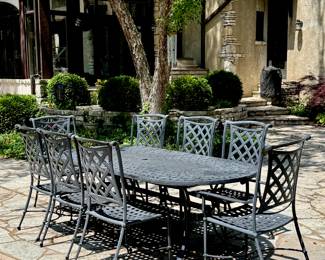 $1800; black metal basketweave pattern patio table and set of 6 side chairs and 2 arm chairs from Amini Gallery; table: 94x40x29; arm chair: 24x25x41; side chair: 21x22x41