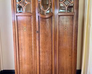 $2200; authentic antique Austrian Biedermeier heirloom linen cabinet that has been passed down for generations, with beveled glass, inlaid wood design and curved door; 44x18x67