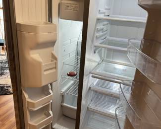Kenmore side by side with water and ice on the door