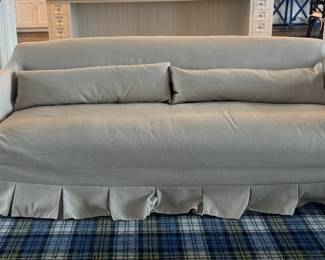 Crate & Barrel Crawford Slipcovered Sofa with Box-Pleated Skirt by Jake Arnold. Measures 86" W x 38" D. Photo 2 of 4.