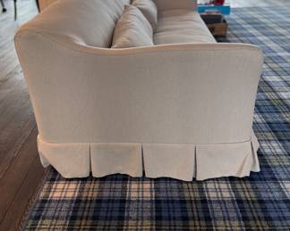 Crate & Barrel Crawford Slipcovered Sofa with Box-Pleated Skirt by Jake Arnold. Measures 86" W x 38" D. Photo 3 of 4.