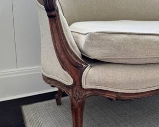 Antique Settee Upholstered in Neutral Fabric. Measures 48” W x 30” D. Photo 2 of 4.